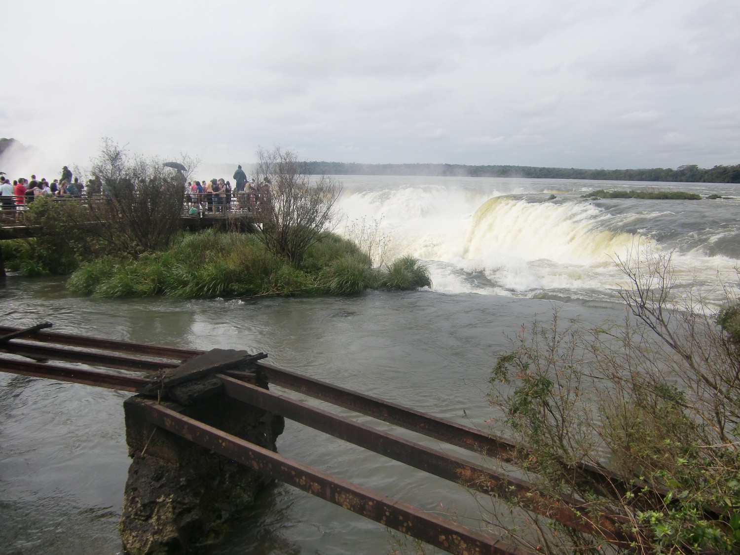 People watching Devil's Throat, the biggest cascade of the Iguazu waterfalls